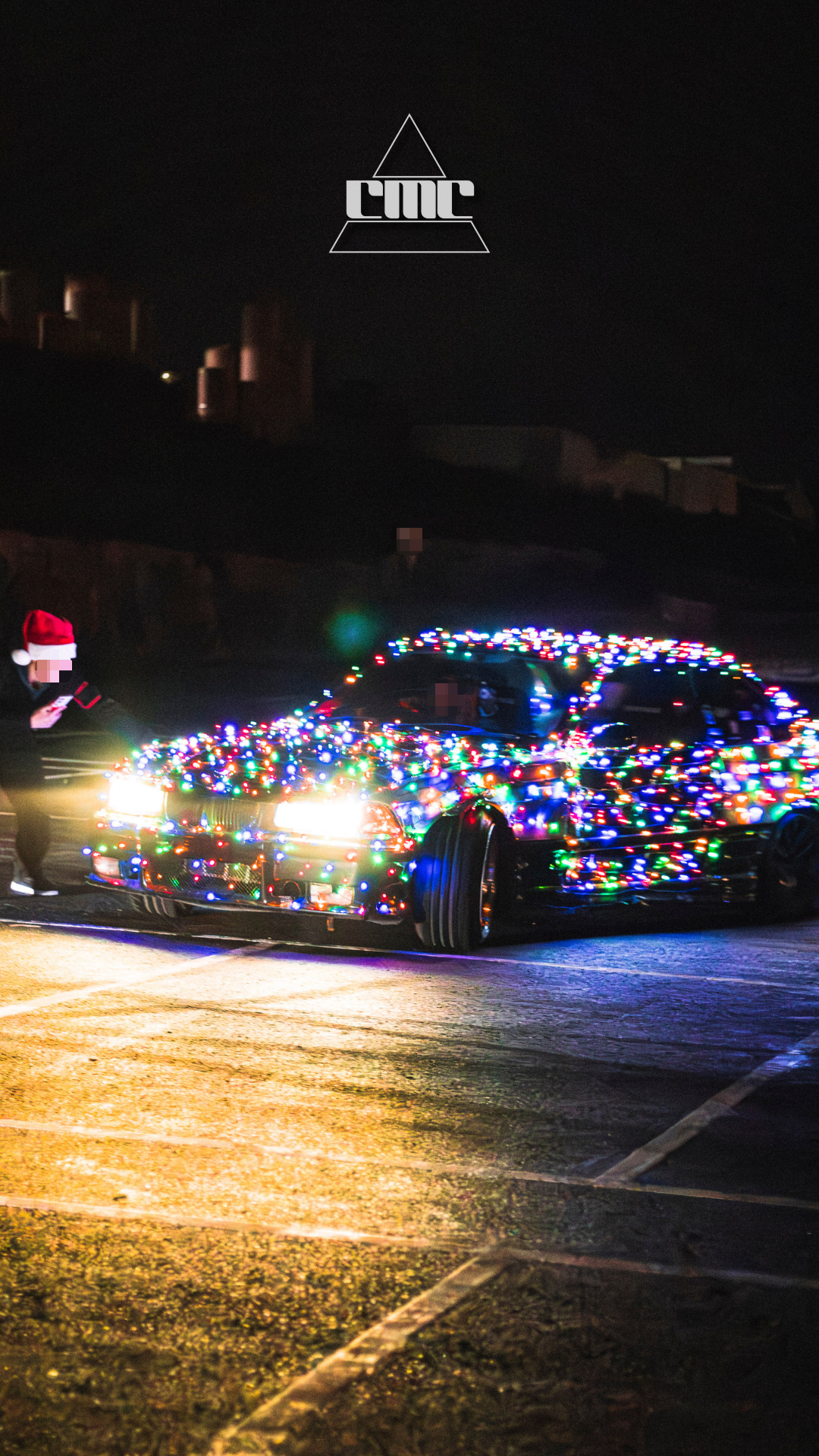 car drifting with christmas lights